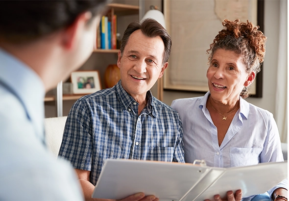 couple meeting with financial advisor to discuss retirement strategies will you have enough to retire