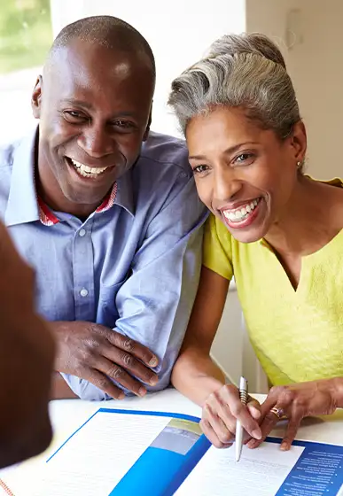 couple with advisor going over financial plan retirement income strategy our 3 core principles levra financial group illinois