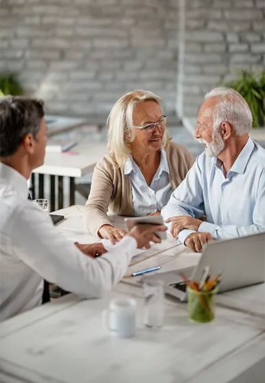 retirees meeting with financial advisor to discuss successful retirement