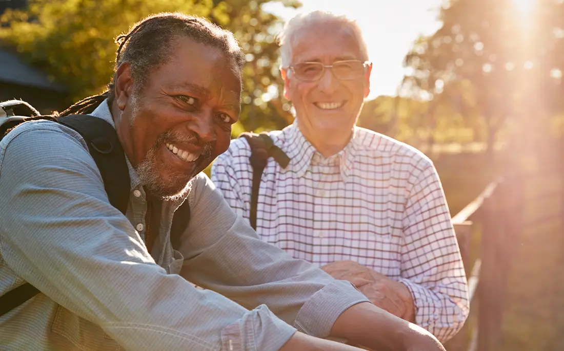 two senior male friends smiling hiking life insurance for retirement levra financial group illinois